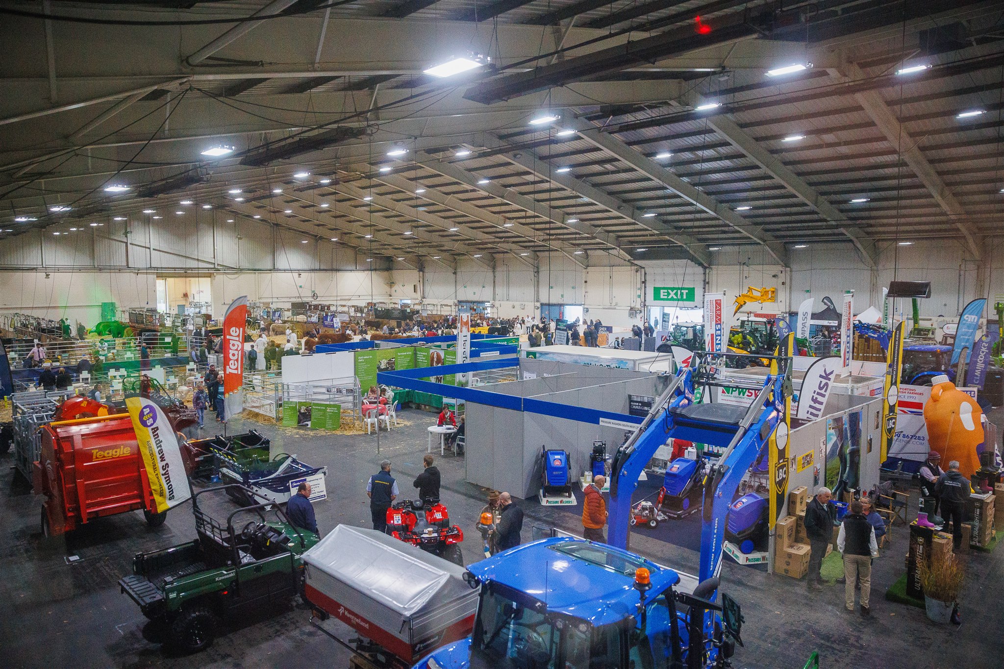 Indoor agricultural exhibition at Westpoint arena showing trade stands and displays
